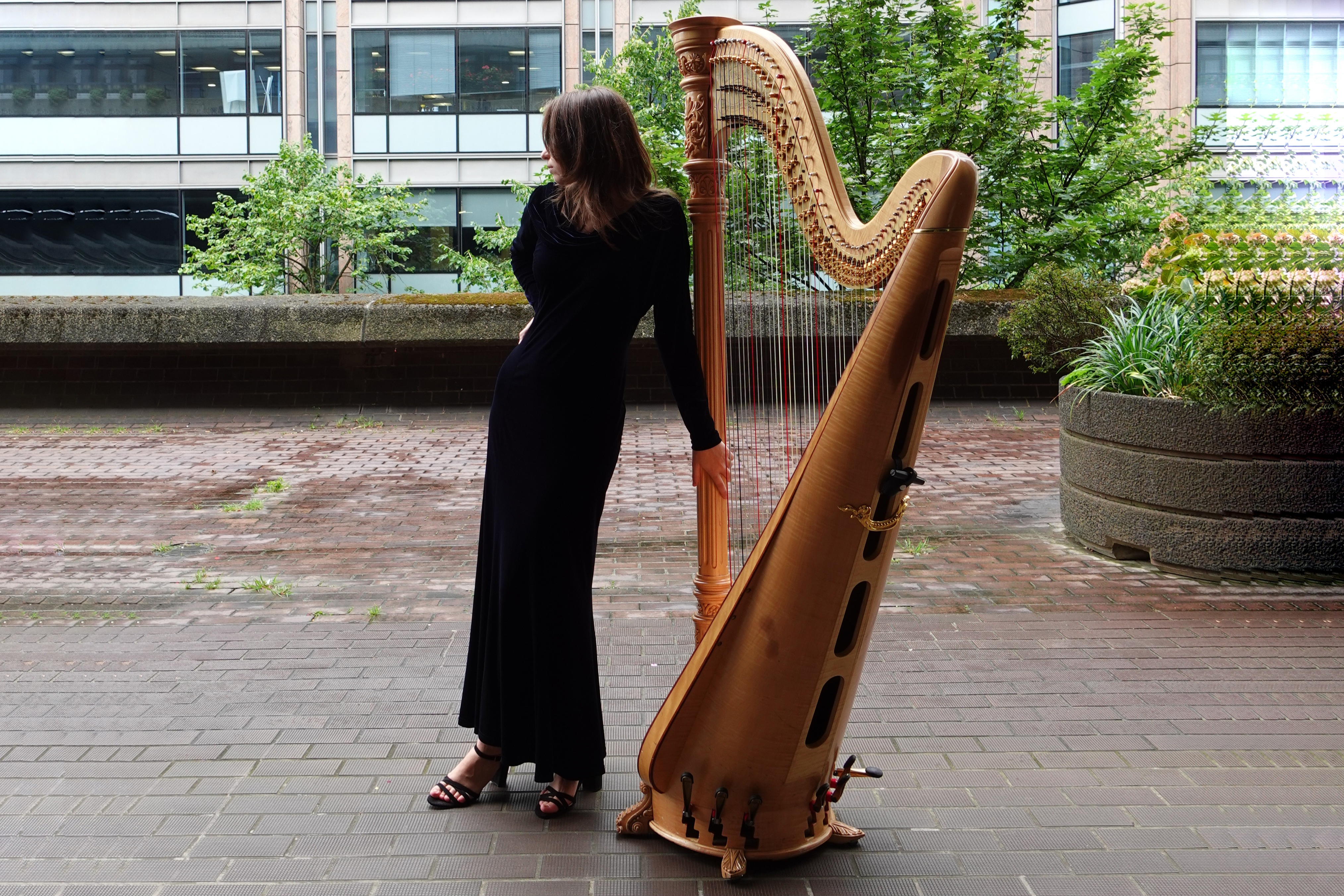 Sabrina Savenkova playing the concert harp